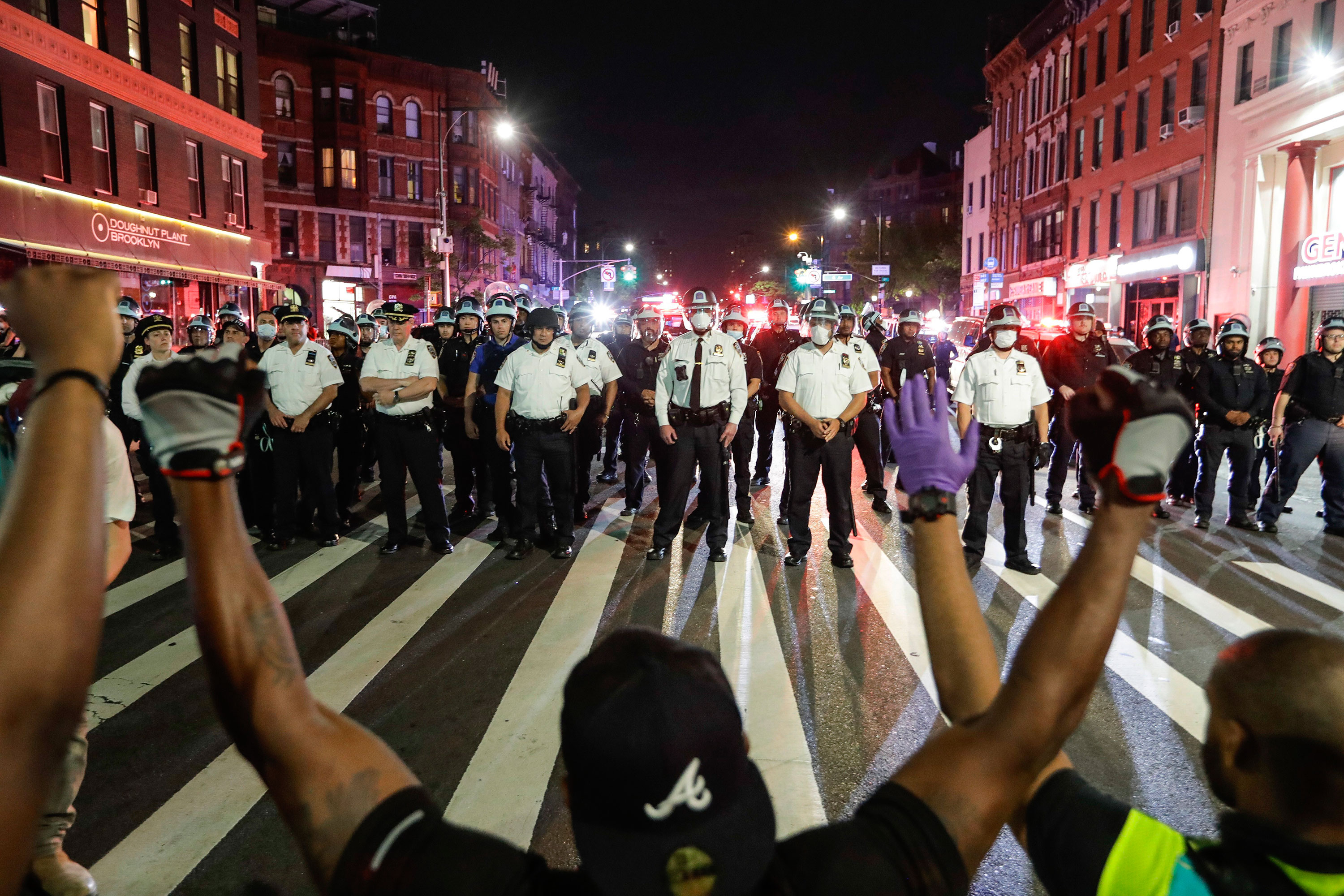 George Floyd Protest: FBI Agents Reassigned Following Kneeling Photo Controversy George Floyd Protest: FBI Agents Reassigned Following Kneeling Photo Controversy